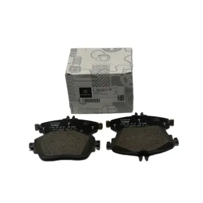 Worn brake pads showing advanced friction material wear prior to complete brake failure